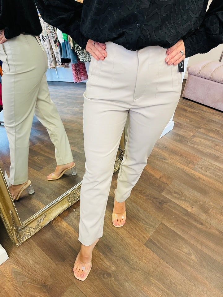 The MADDIE beige pleather trousers